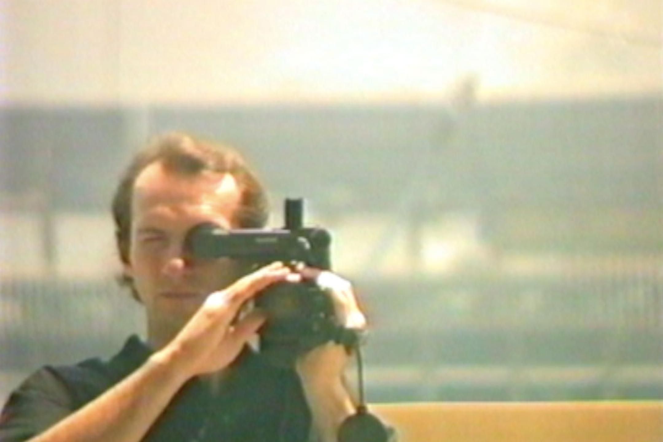 Portrait of a man with a video camera 
