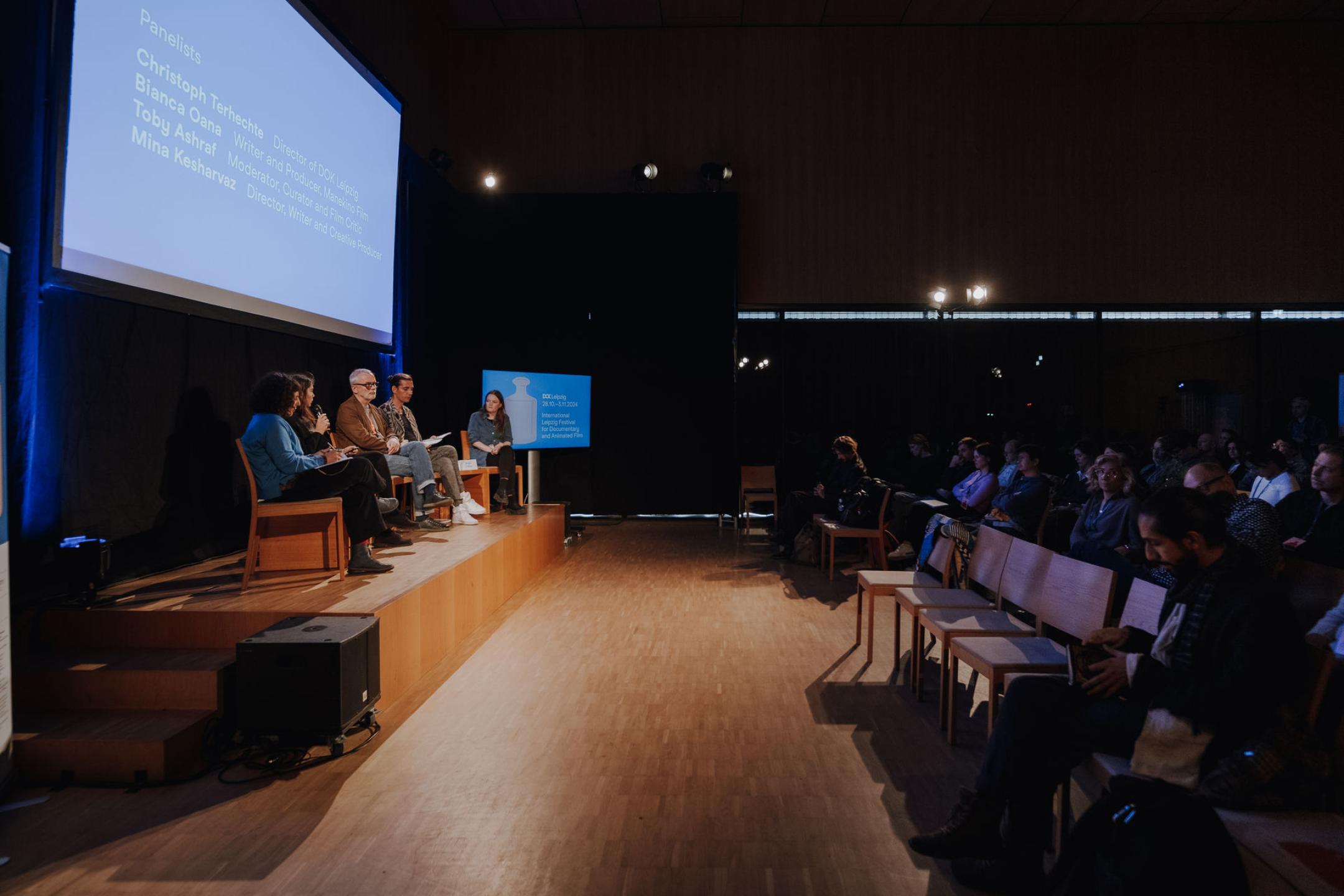 photograph of a stage and parts of an audience