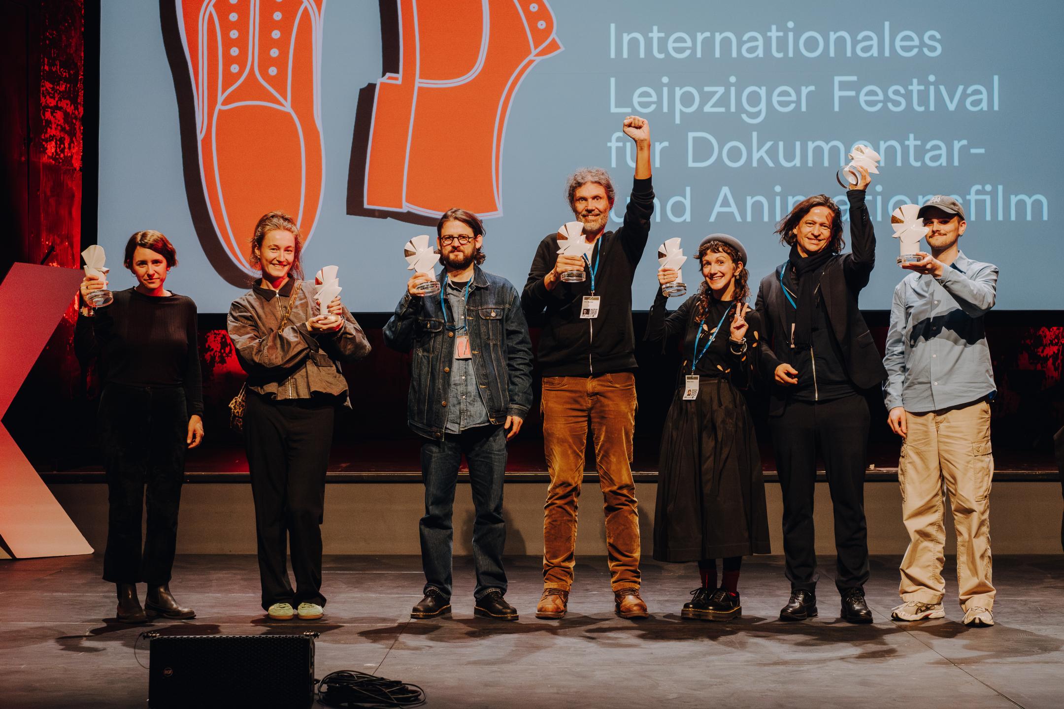 The 2025 winners of the doves holding their awards up at the ceremony