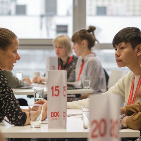 People on a table while working in the co-pro market