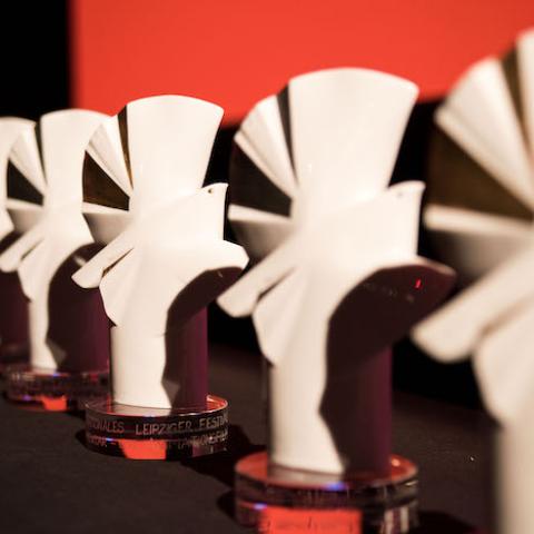 White porcelain doves, the prizes of DOK Leipzig, in a row