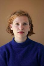 Portrait of Celine Daemen wearing a blue sweater