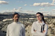 Portrait of Anders Ehlin & Selma Boskailo in front of a green screen showing a landscape