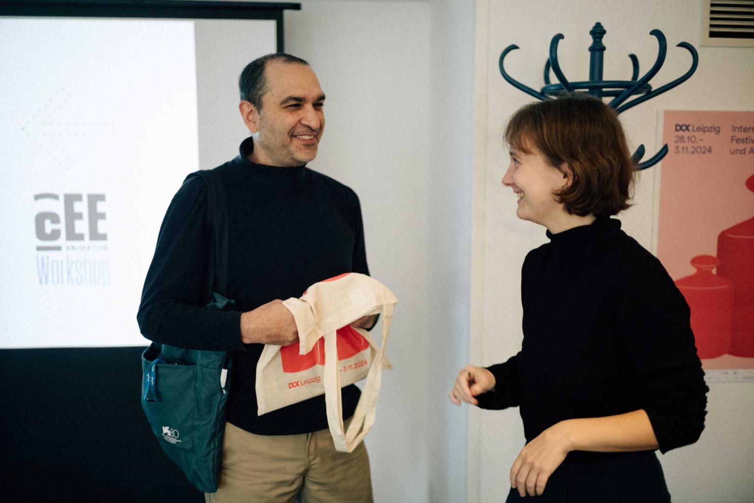 Uri Kranot and Dok Leipzig's animation lab coordinator are laughing together