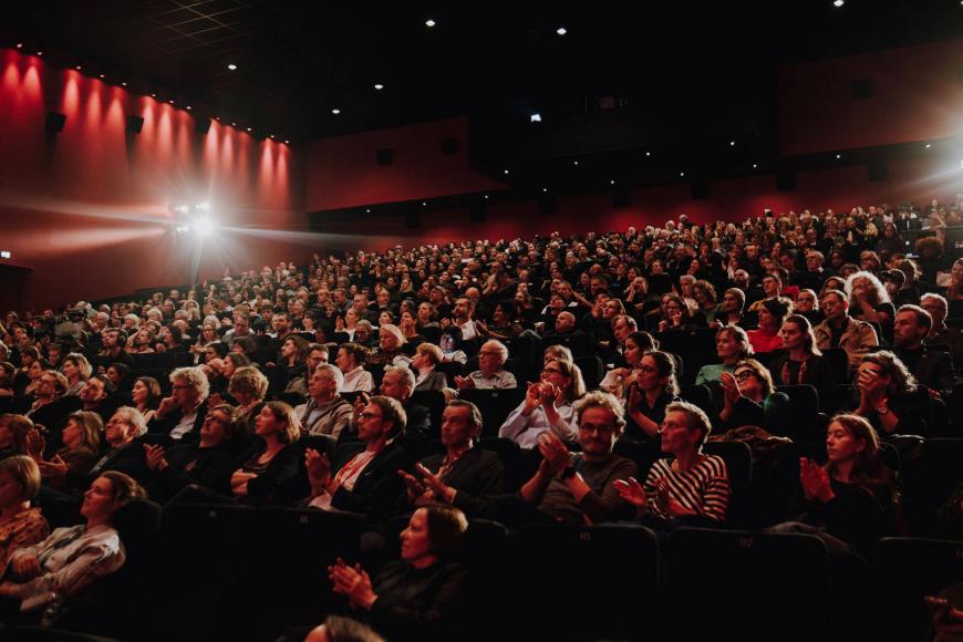 A photo of a crowded cinema during the opening ceremony in the CineStar.